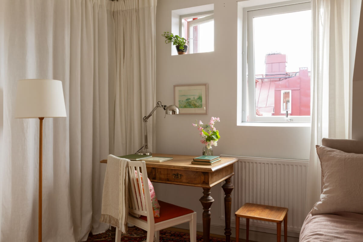 Antiques and Modern Additions in a Cozy Top Floor Duplex Apartment 26 antique desk bedroom
