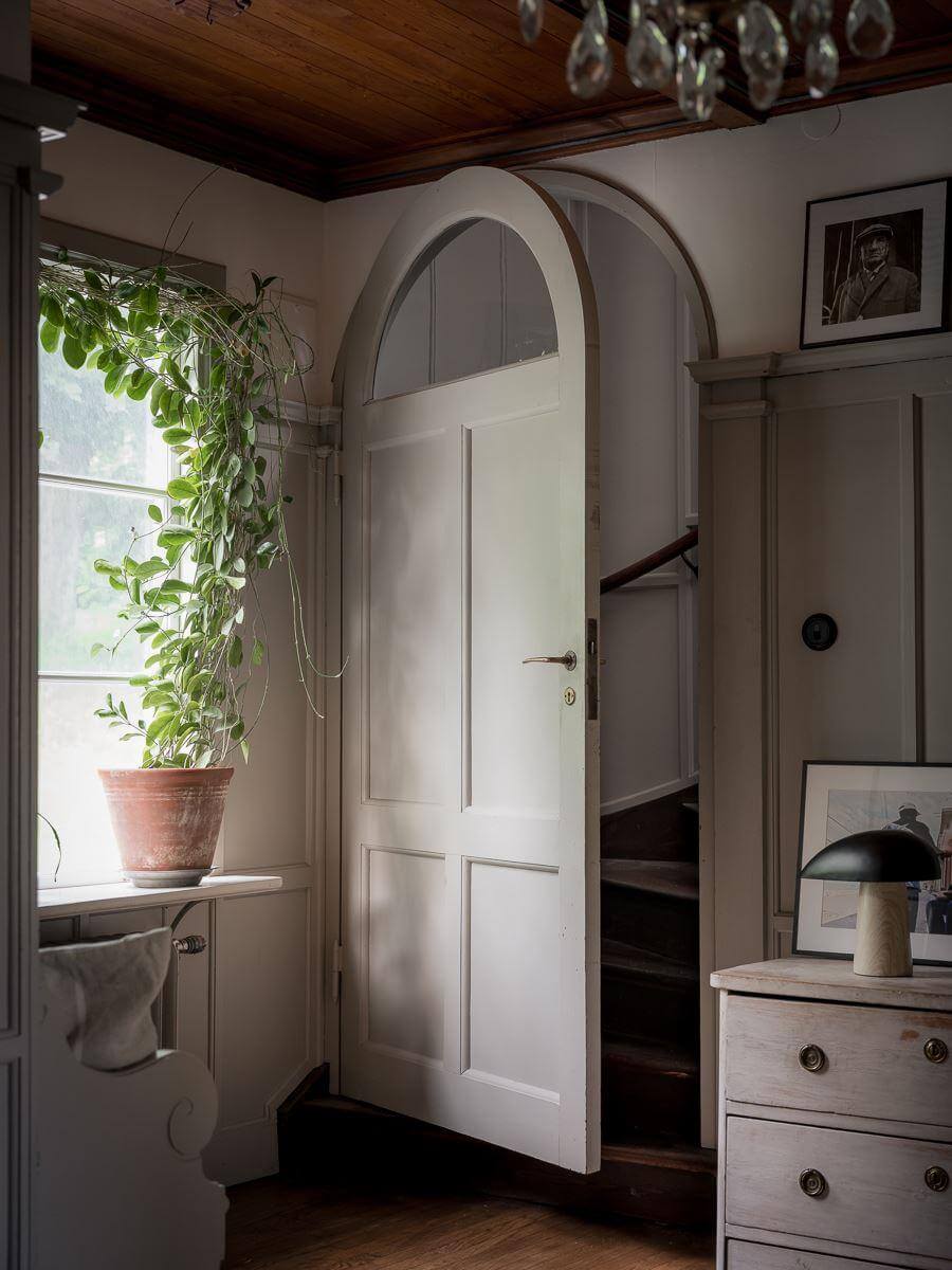A Floral Painted Ceiling in a 1920s Family Home in Sweden 21 arched door to staircase