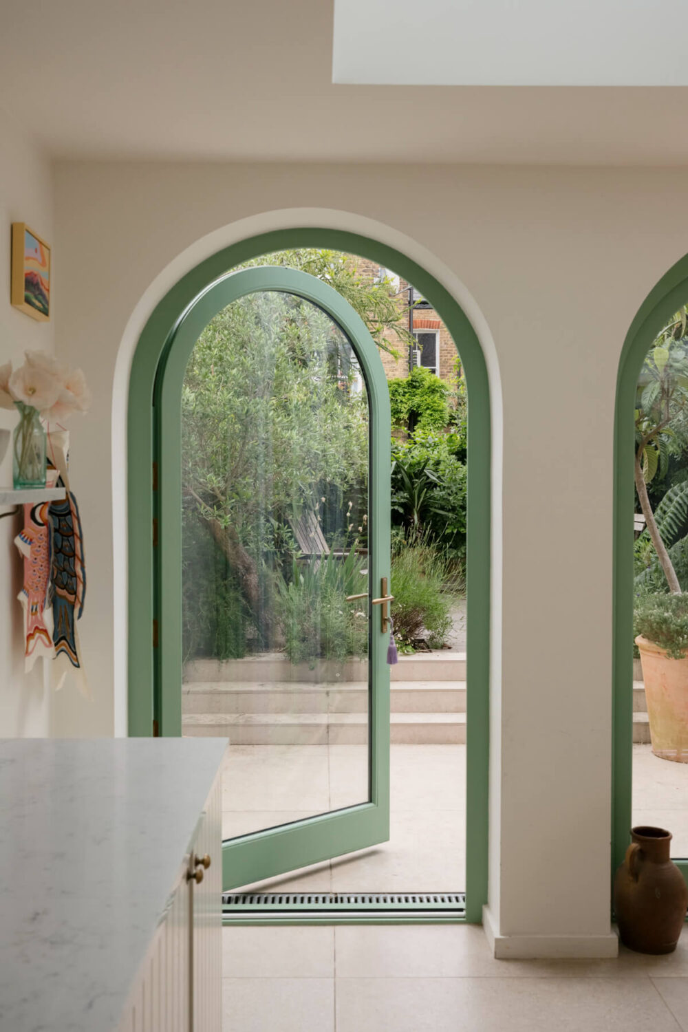 A Victorian Family House with a Tuscan-Inspired Kitchen Extension 12 arched glass door