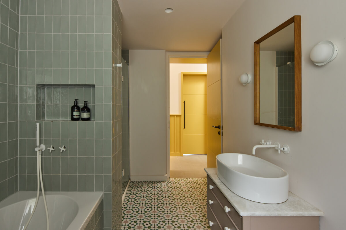 A Modern Bungalow with a Terrazzo Kitchen and Magnificent Views 23 bathroom blue-green tiles