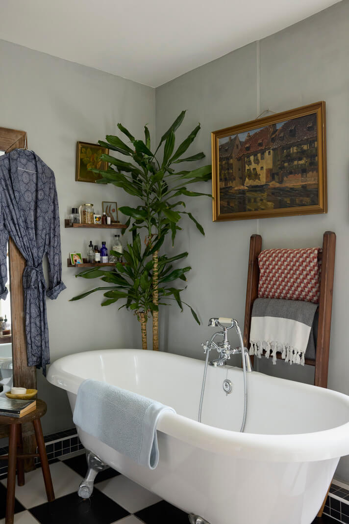 Cozy Living Spaces and Limewash Walls in an Artist's English Home 16 bathroom freestanding bath checkerboard floor