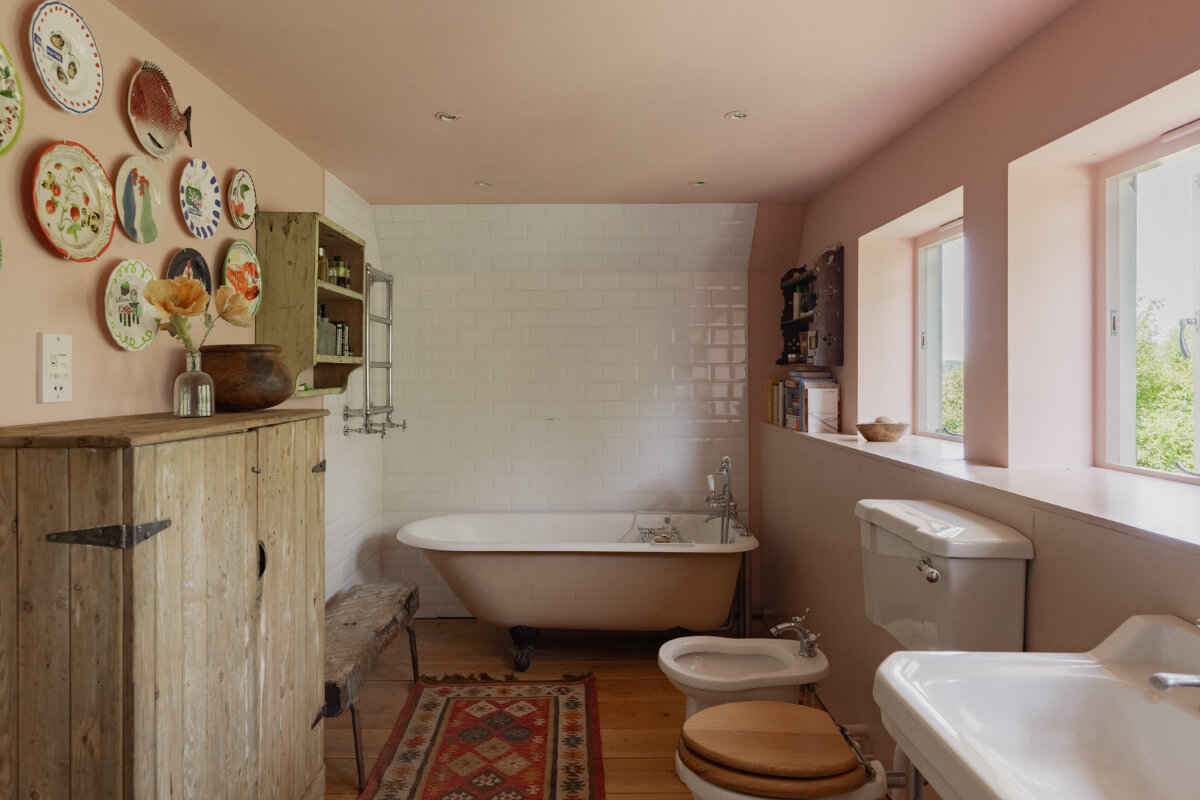 Colorful Interiors and Period Features in a 16th-Century Farmhouse 19 bathroom freestanding bath light pink ceiling