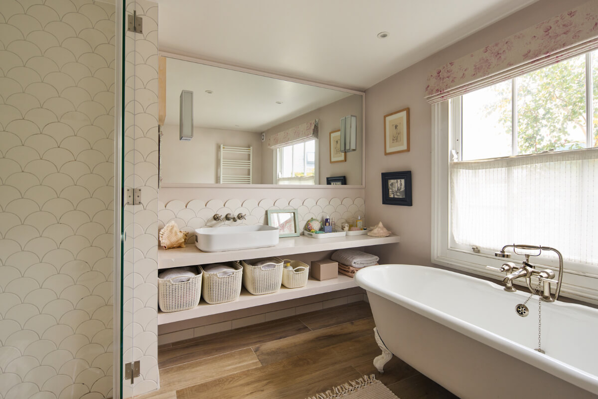Light-Filled Interiors in a Grand Early Victorian House in Notting Hill 22 bathroom freestanding bath scallop tiles