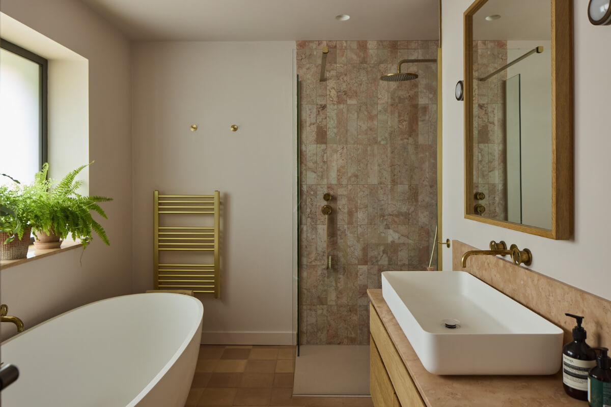 A Modern Bungalow with a Terrazzo Kitchen and Magnificent Views 15 bathroom pink shower tiles