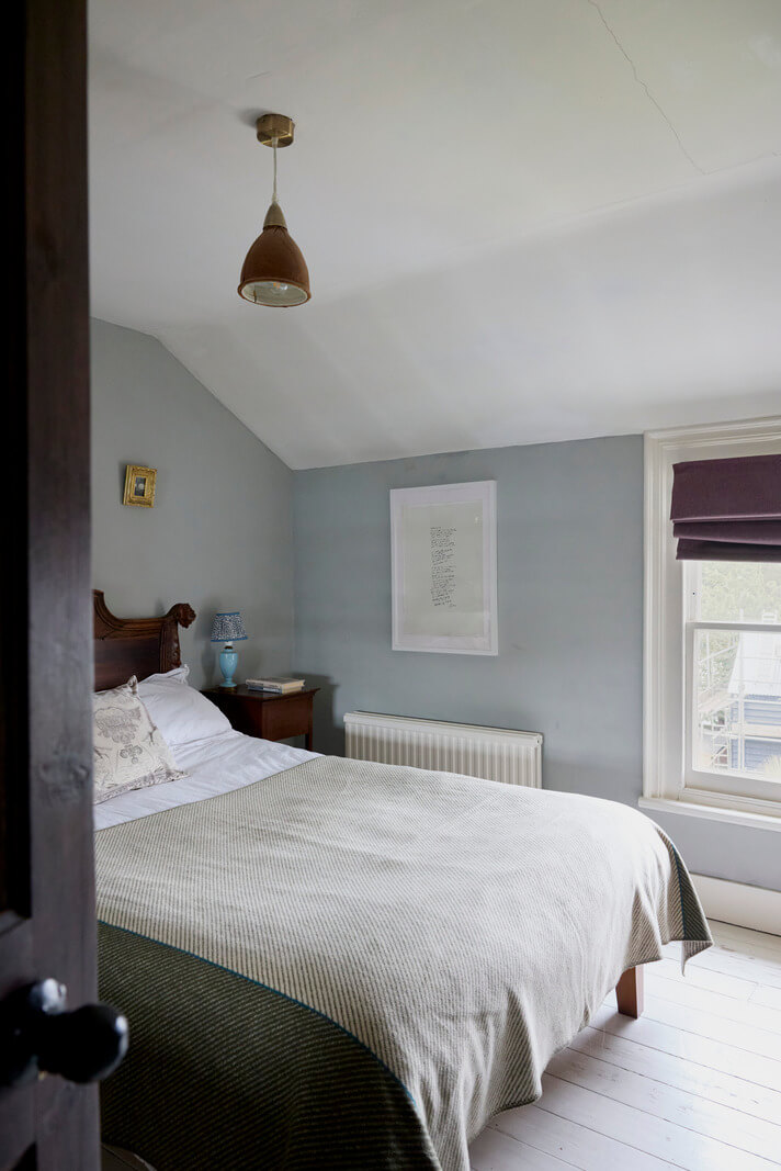 Cozy Living Spaces and Limewash Walls in an Artist's English Home 19 bedroom blue-gray walls