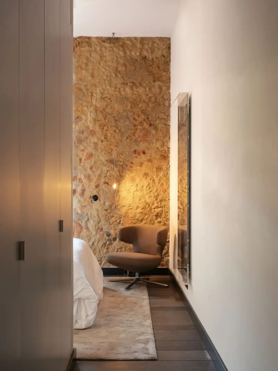 An Eye-Catching Stone Wall in a Beautiful Lisbon Apartment 6 bedroom built-in wardrobes stone wall