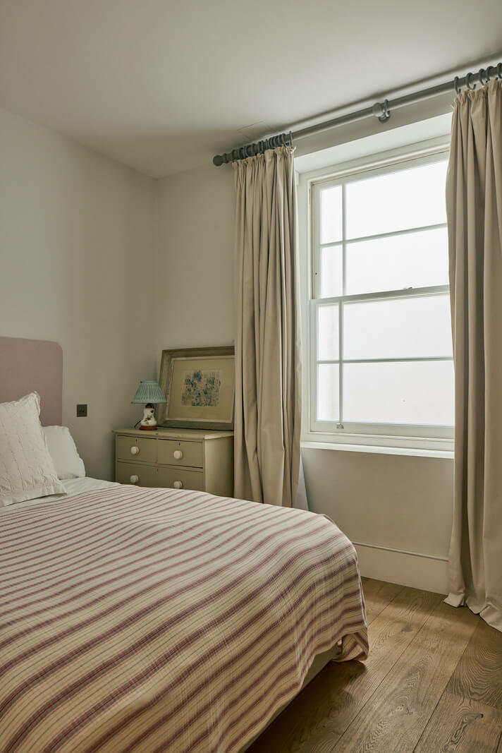 Light-Filled Interiors in a Grand Early Victorian House in Notting Hill 24 bedroom pink headboard