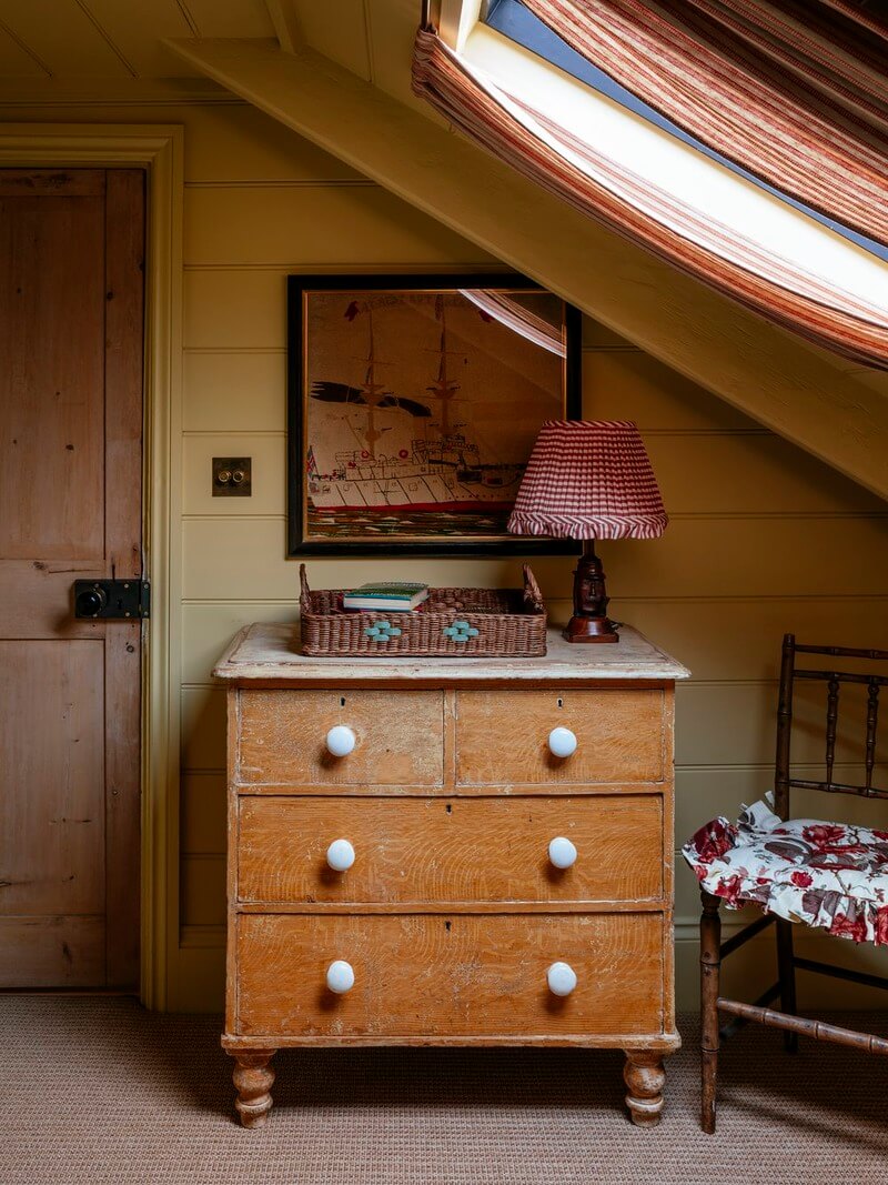 Bespoke Interiors and an Earthy Color Palette in a Historic Cottage 21 bedroom slanted ceiling paneled walls
