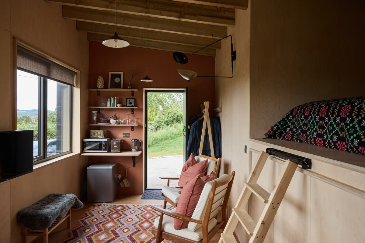 A Modern Bungalow with a Terrazzo Kitchen and Magnificent Views 26 bedroom terracotta colored wall loft bed