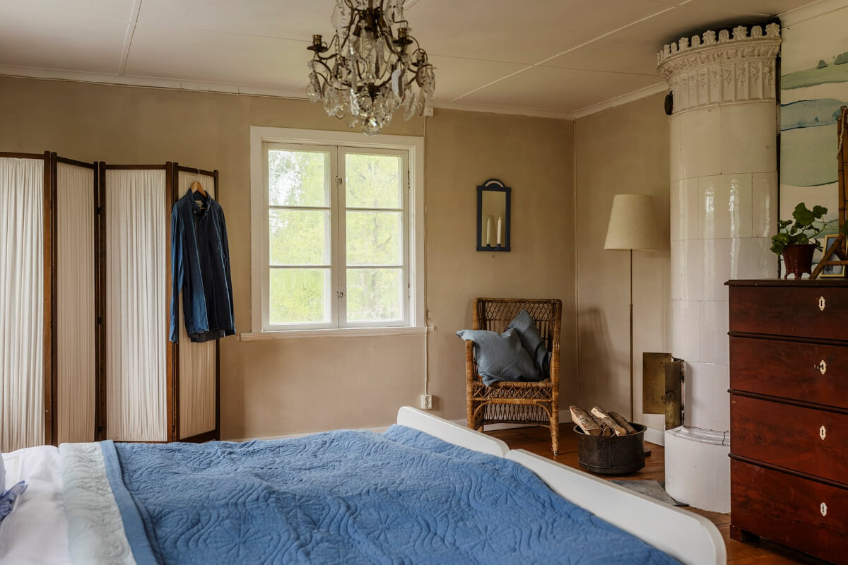 A Beautifully Preserved Historic Country House in Sweden 24 bedroom with fireplace