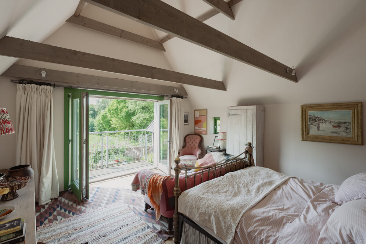 Colorful Interiors and Period Features in a 16th-Century Farmhouse 18 bedroom wooden beams balcony