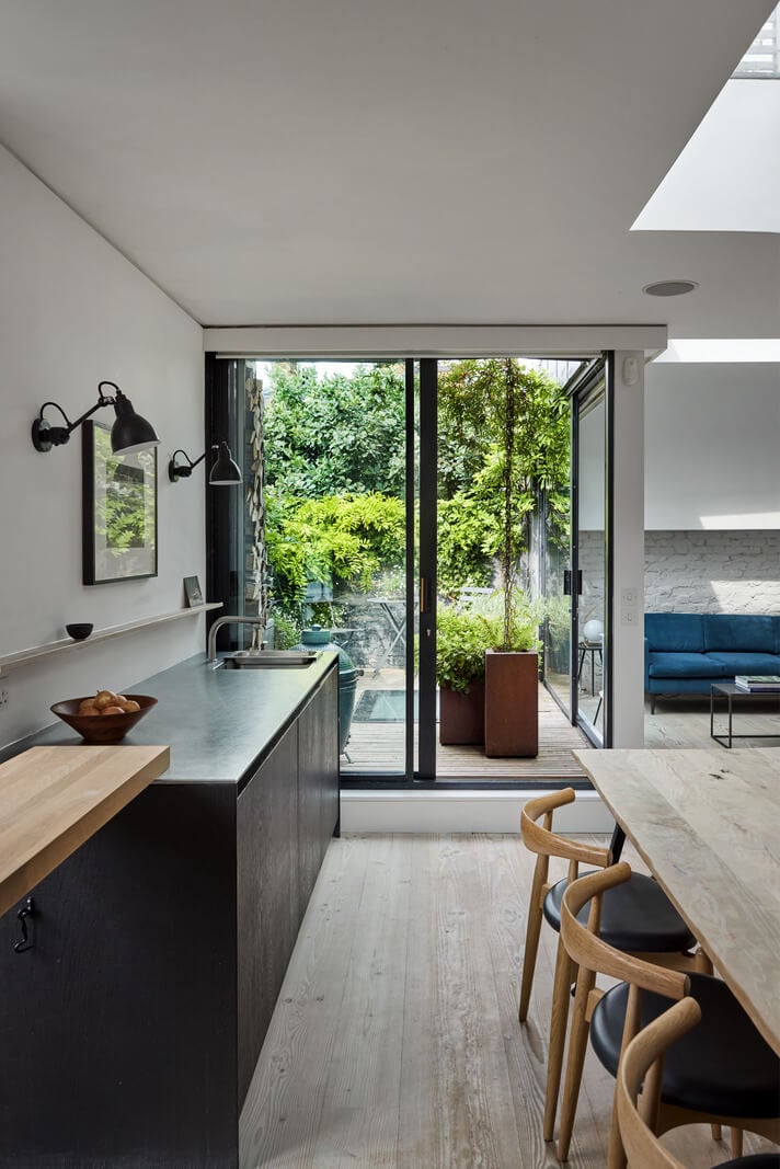 A Black and White Primrose Hill Mews House with a Roof Terrace 2 black kitchen glass wall