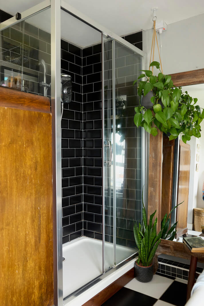 Cozy Living Spaces and Limewash Walls in an Artist's English Home 17 black subway tiles shower