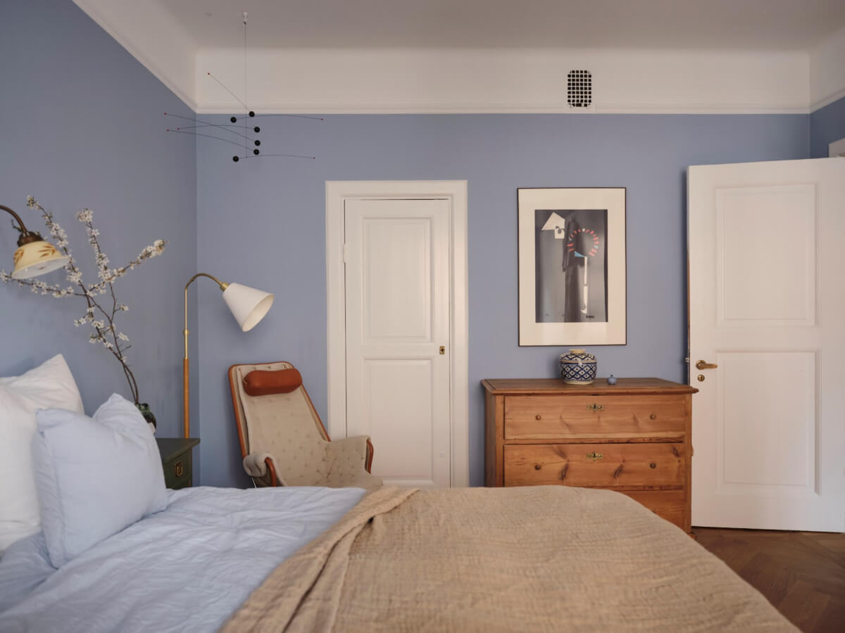 An Early 20th Century Apartment with a Muted Green Kitchen 16 blue bedroom wooden dresser