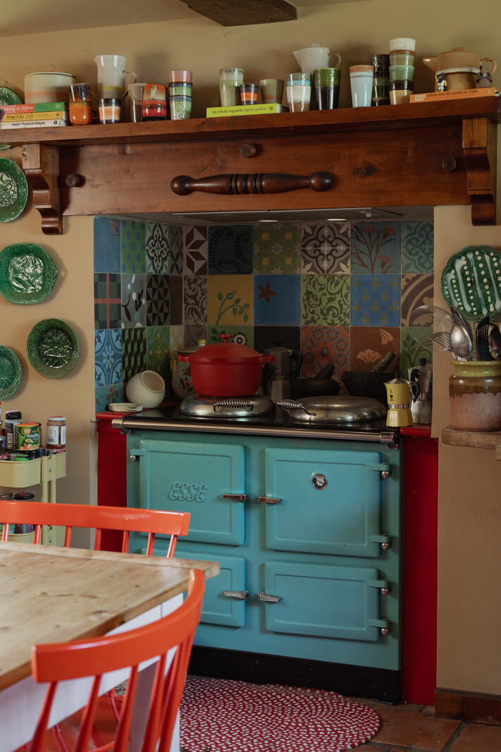 Colorful Interiors and Period Features in a 16th-Century Farmhouse 8 blue stove colorful tiles