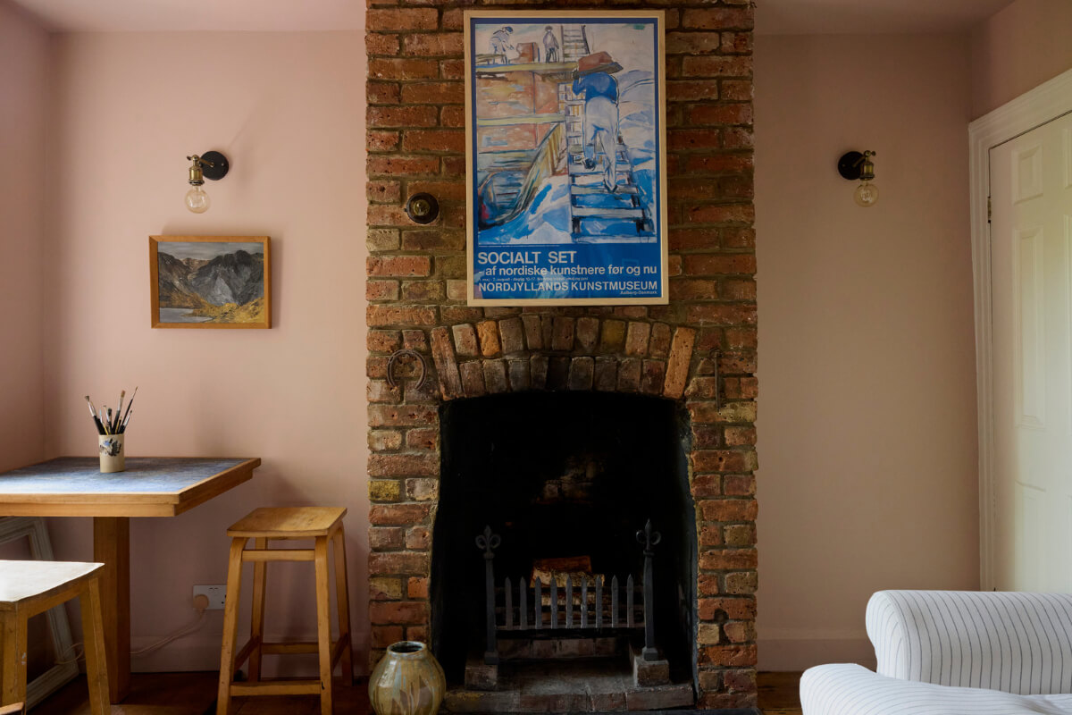 Cozy Living Spaces and Limewash Walls in an Artist's English Home 8 brick fireplace