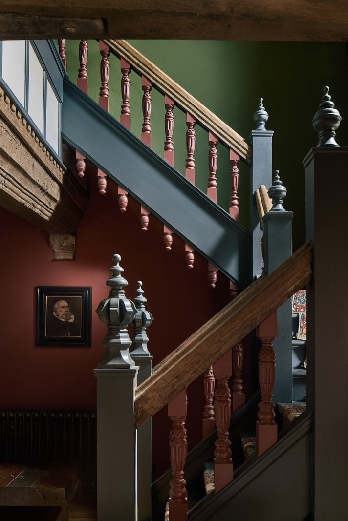 Unique Rooms and Historic Splendor in a Medieval English Country House 11 colorful staircase