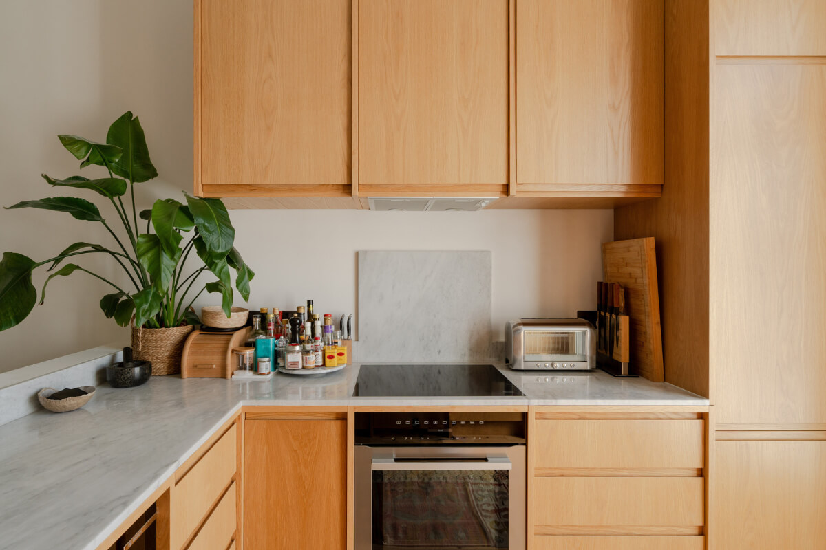 Historic Charm and Modern Design in a Light-Filled Pimlico Apartment 14 custom oak kitchen cabinets marble countertop