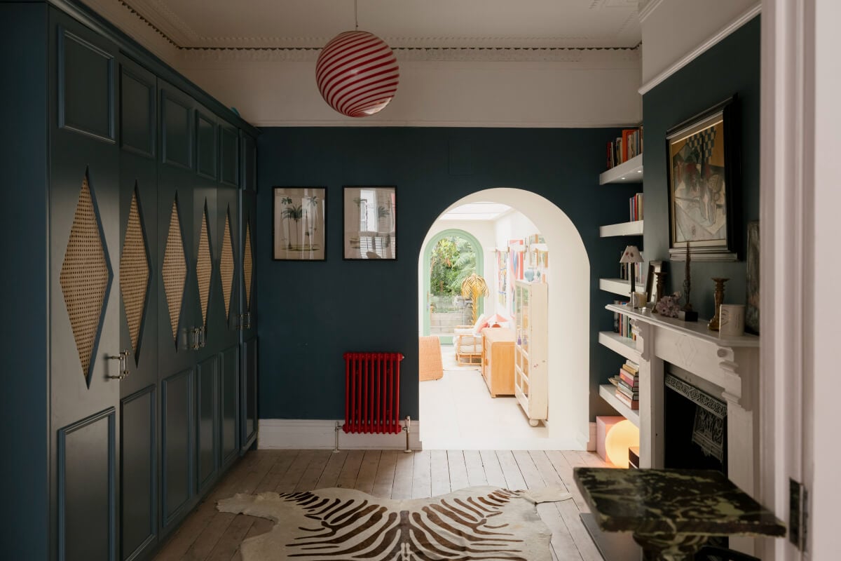 A Victorian Family House with a Tuscan-Inspired Kitchen Extension 6 dark blue room built-in cabinets fireplace