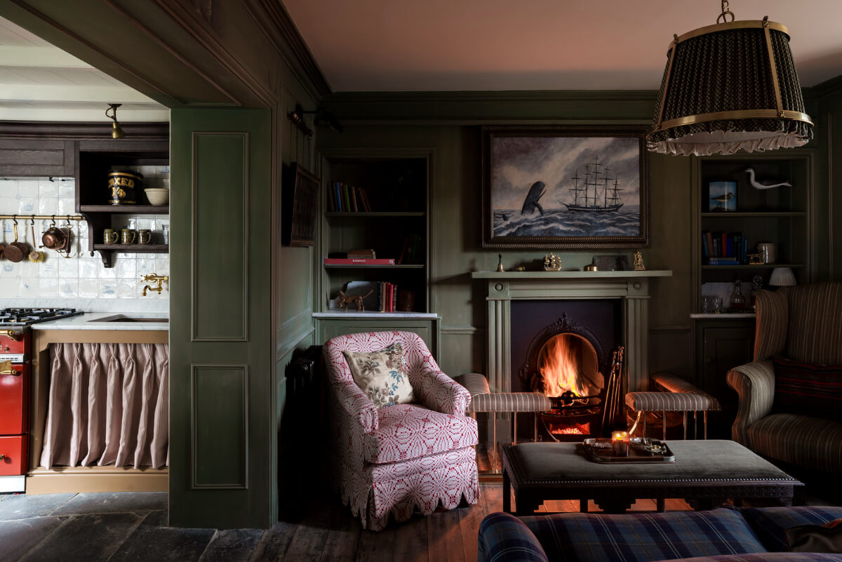 Bespoke Interiors and an Earthy Color Palette in a Historic Cottage 1 dark green sitting room fireplace