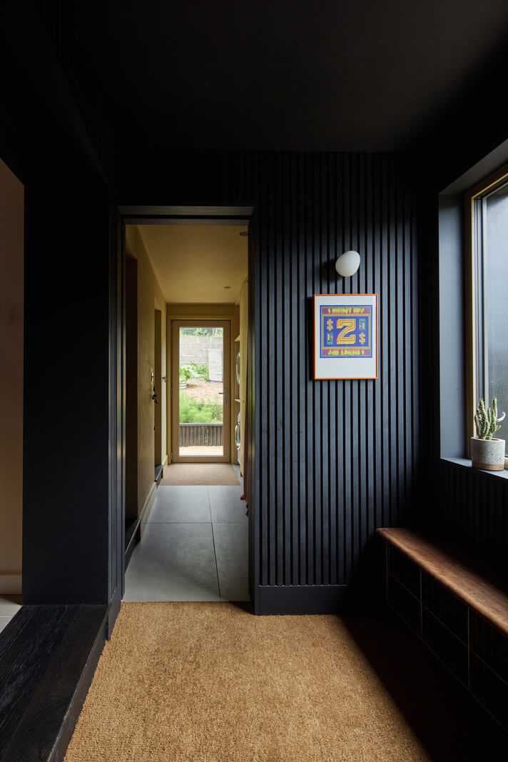 A Modern Bungalow with a Terrazzo Kitchen and Magnificent Views 24 dark paneled hall