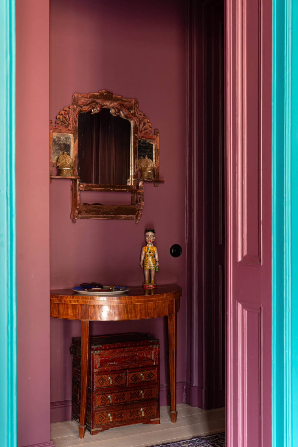 Bold Teal Walls and Antiques in a Turn-of-the-Century Apartment 17 dark pink hall antique table