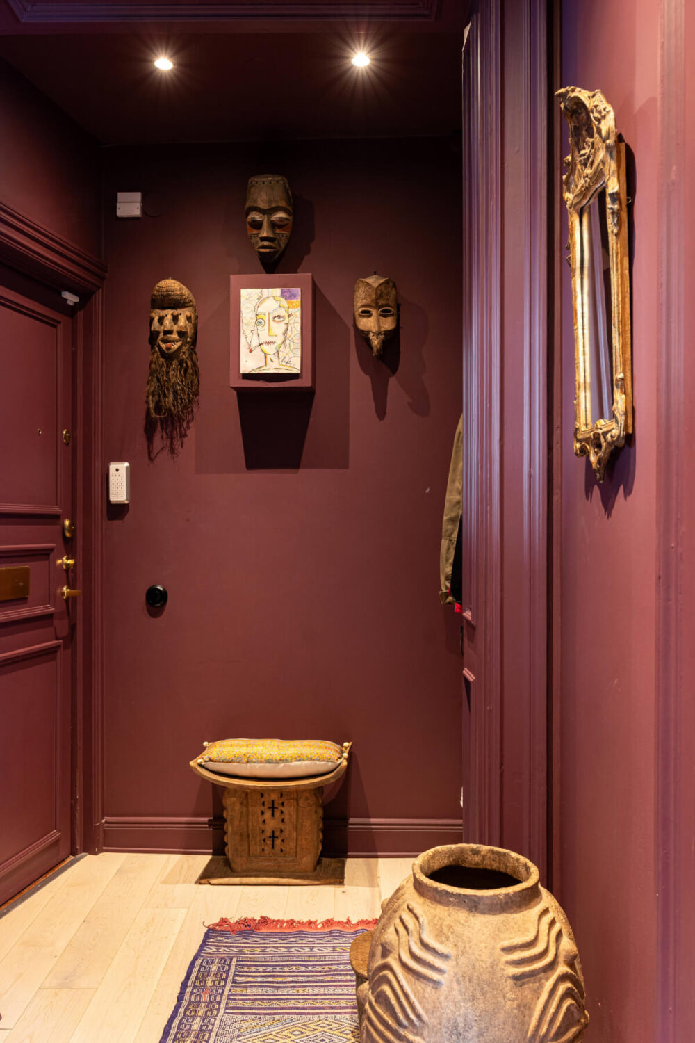 Bold Teal Walls and Antiques in a Turn-of-the-Century Apartment 18 dark pink hallway