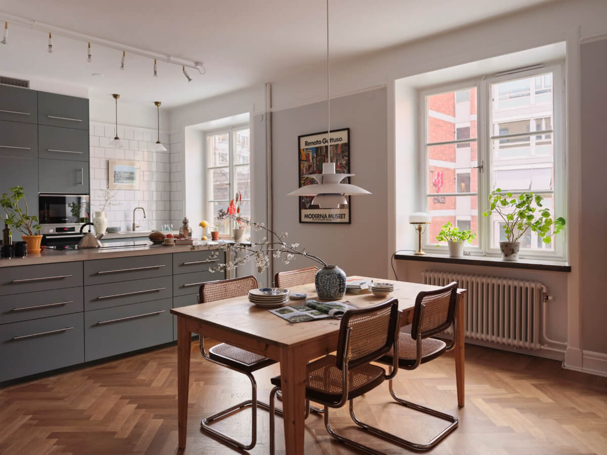 An Early 20th Century Apartment with a Muted Green Kitchen 2 dining area