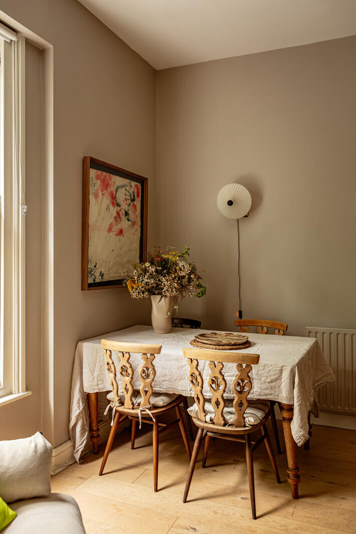 Muted Gray Tones and Built-In Storage in a London Apartment 5 dining table ornate wooden chairs