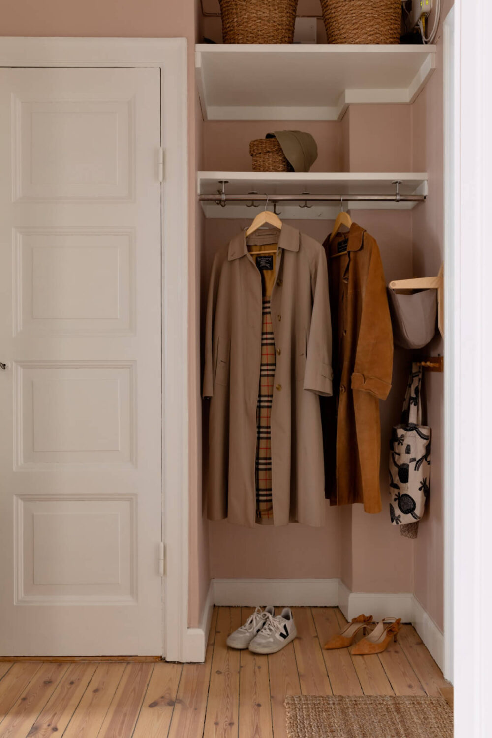 A Nice Color Palette and Original Elements in a Cozy 1930s Apartment 23 entry hall storage niche coats shelves A Nice Color Palette and Original Elements in a Cozy 1930s Apartment