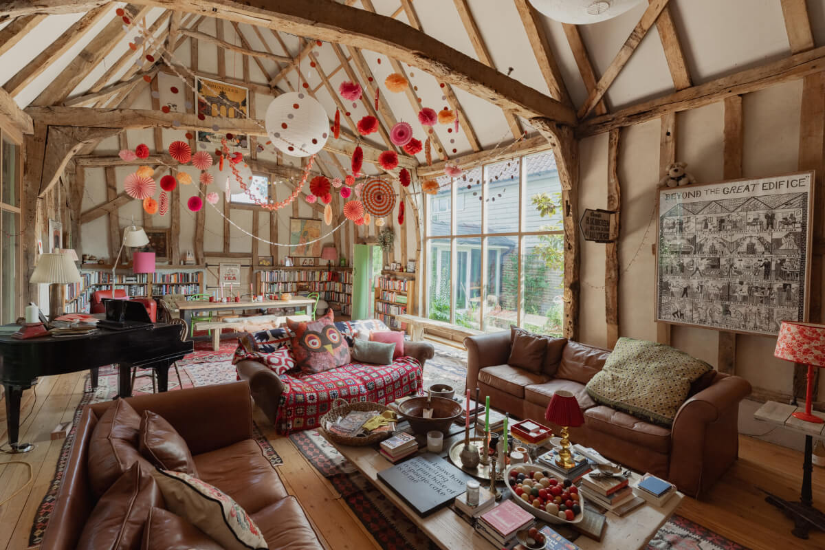 Colorful Interiors and Period Features in a 16th-Century Farmhouse 2 fomer barn living room high pitched ceilings wooden beams