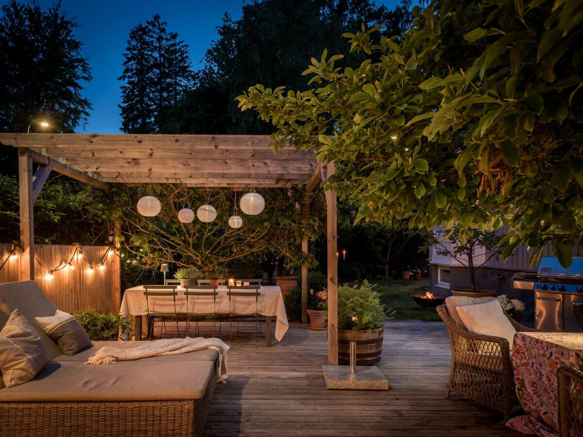 A Floral Painted Ceiling in a 1920s Family Home in Sweden 41 garden with pergola at night