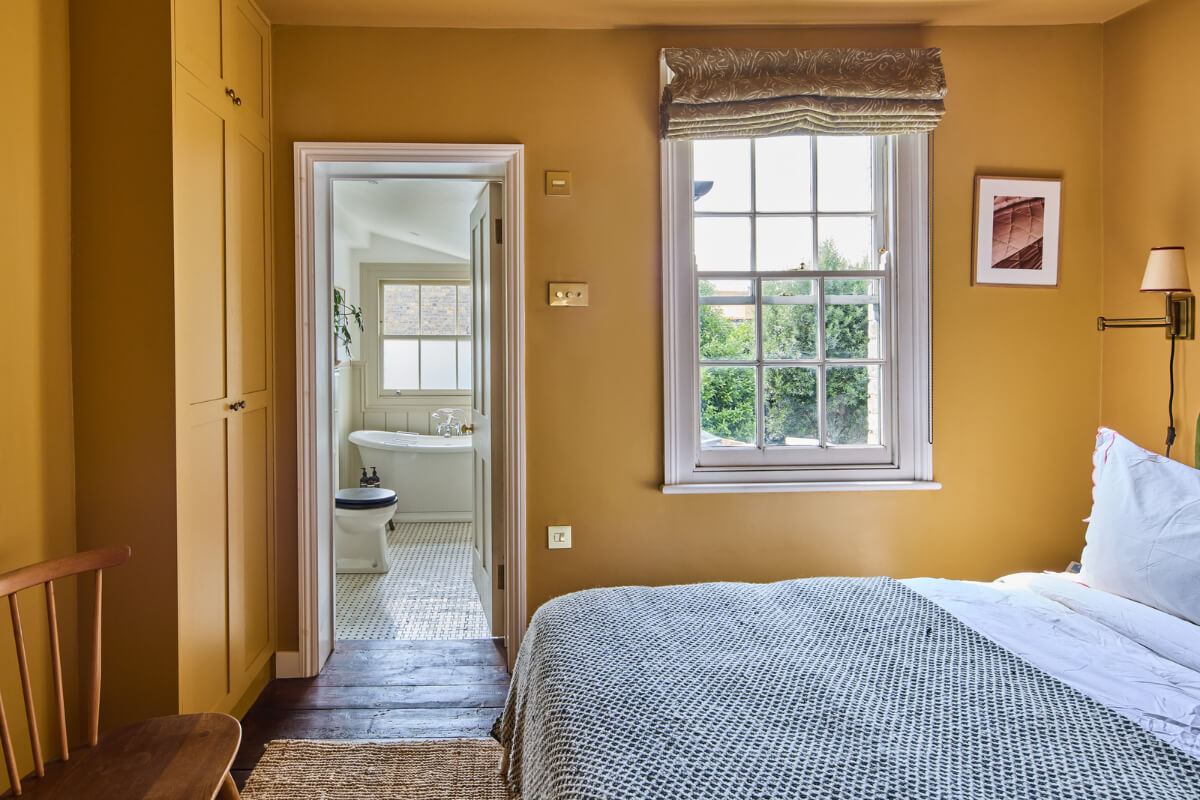 The 2026 Color of the Year (with Color Palettes & Inspiration) 15 golden yellow bedroom