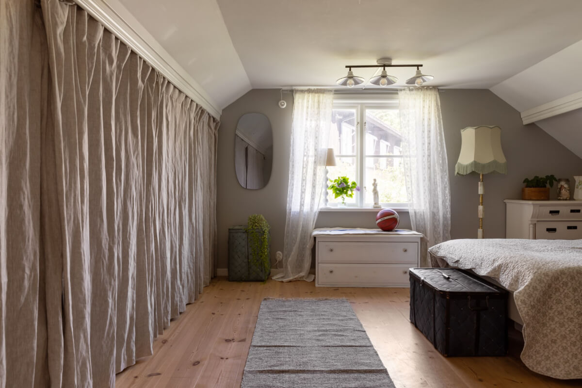 An Idyllic 18th Century Cottage with a Charming Garden 37 gray bedroom storage behind curtains