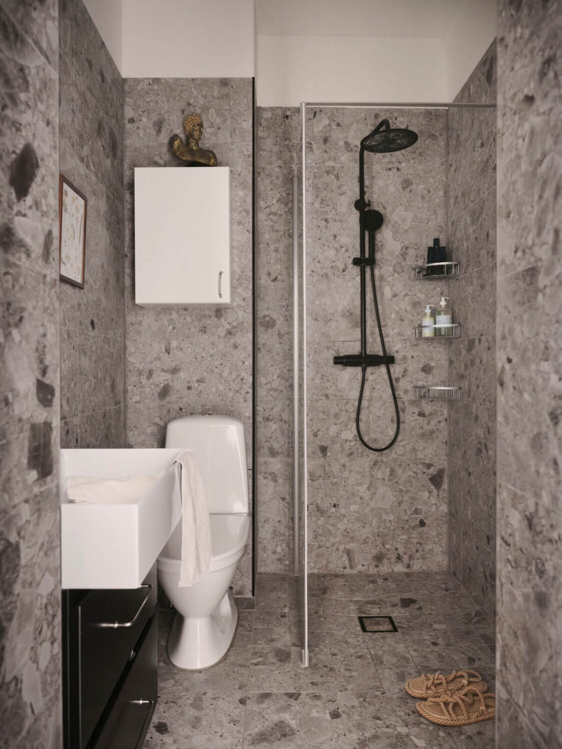 An Early 20th Century Apartment with a Muted Green Kitchen 21 gray tiled bathroom black fittings