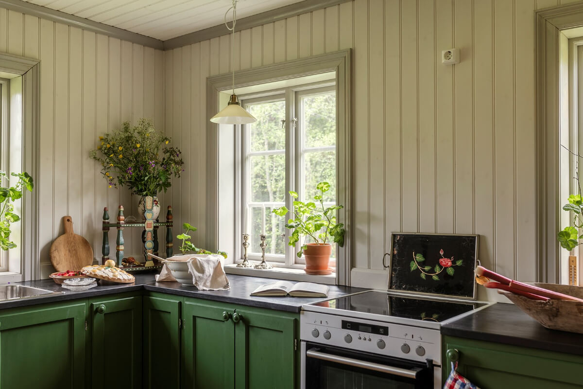 A Beautifully Preserved Historic Country House in Sweden 8 green cabinets tongue and groove paneling
