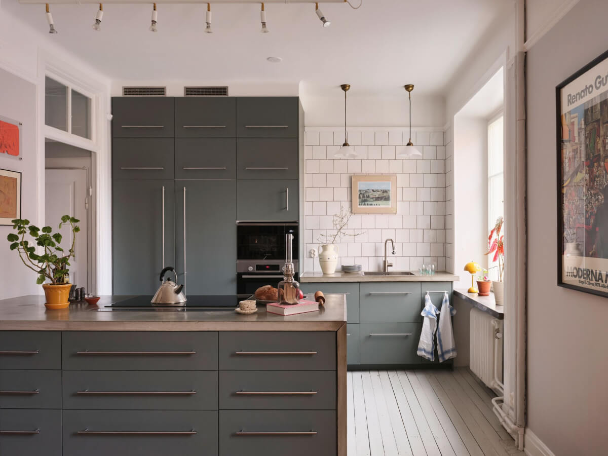 An Early 20th Century Apartment with a Muted Green Kitchen 3 green kitchen concrete countertop