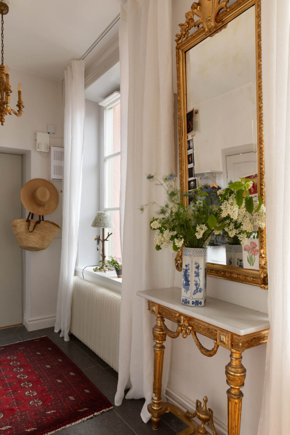Antiques and Modern Additions in a Cozy Top Floor Duplex Apartment 30 hall antique table mirror