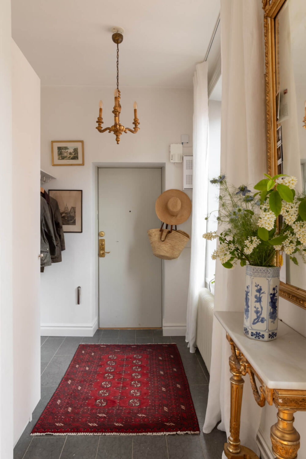 Antiques and Modern Additions in a Cozy Top Floor Duplex Apartment 31 hall tile floor