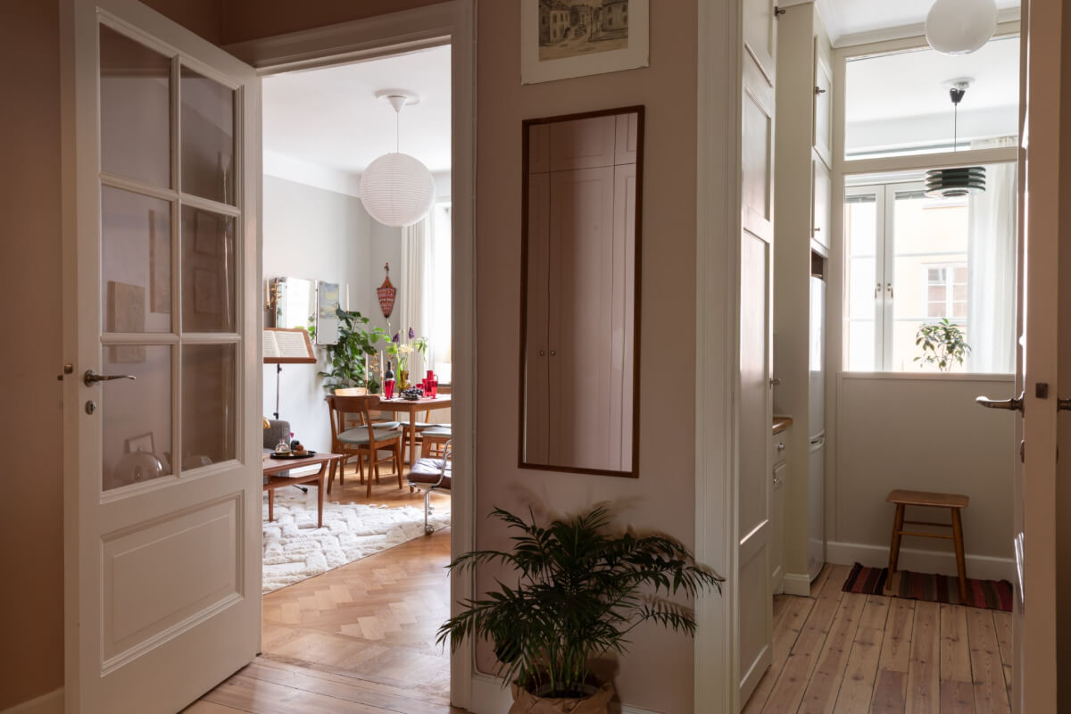 A Nice Color Palette and Original Elements in a Cozy 1930s Apartment 12 hall view into kitchen and living rom