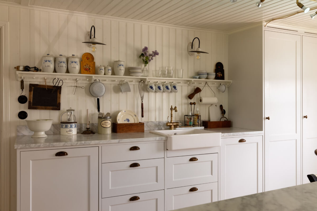 An Idyllic 18th Century Cottage with a Charming Garden 9 kitchen butler sink tongue and groove paneling brass fittings