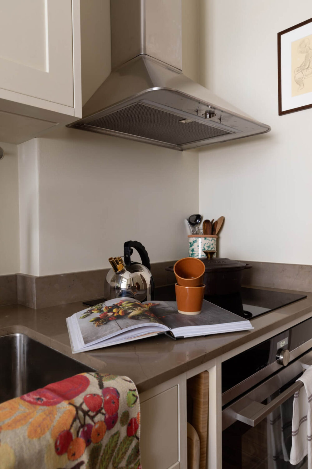 A Nice Color Palette and Original Elements in a Cozy 1930s Apartment 17 kitchen cooker