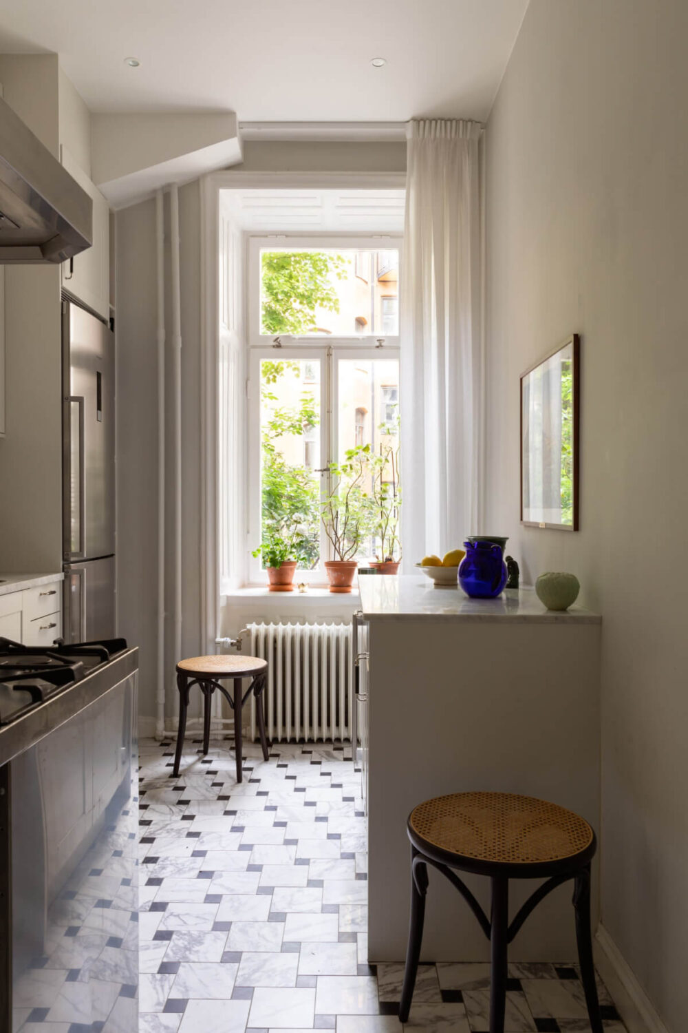 A Classic Late 19th-Century Apartment with a Private Courtyard Terrace 20 kitchen large windows marble floor