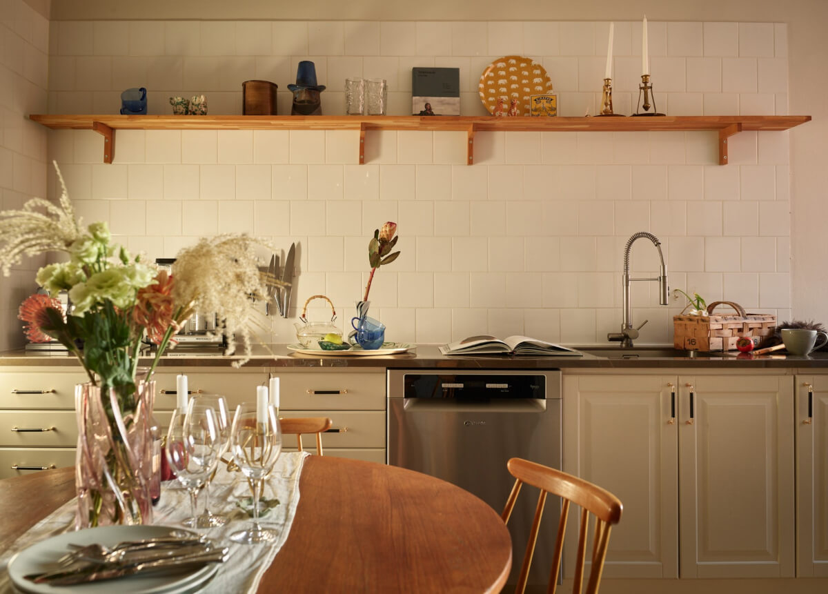 Historic Charm and an Industrial Glass Wall in a Stockholm Apartment 5 kitchen white backsplash tiles wooden shelf