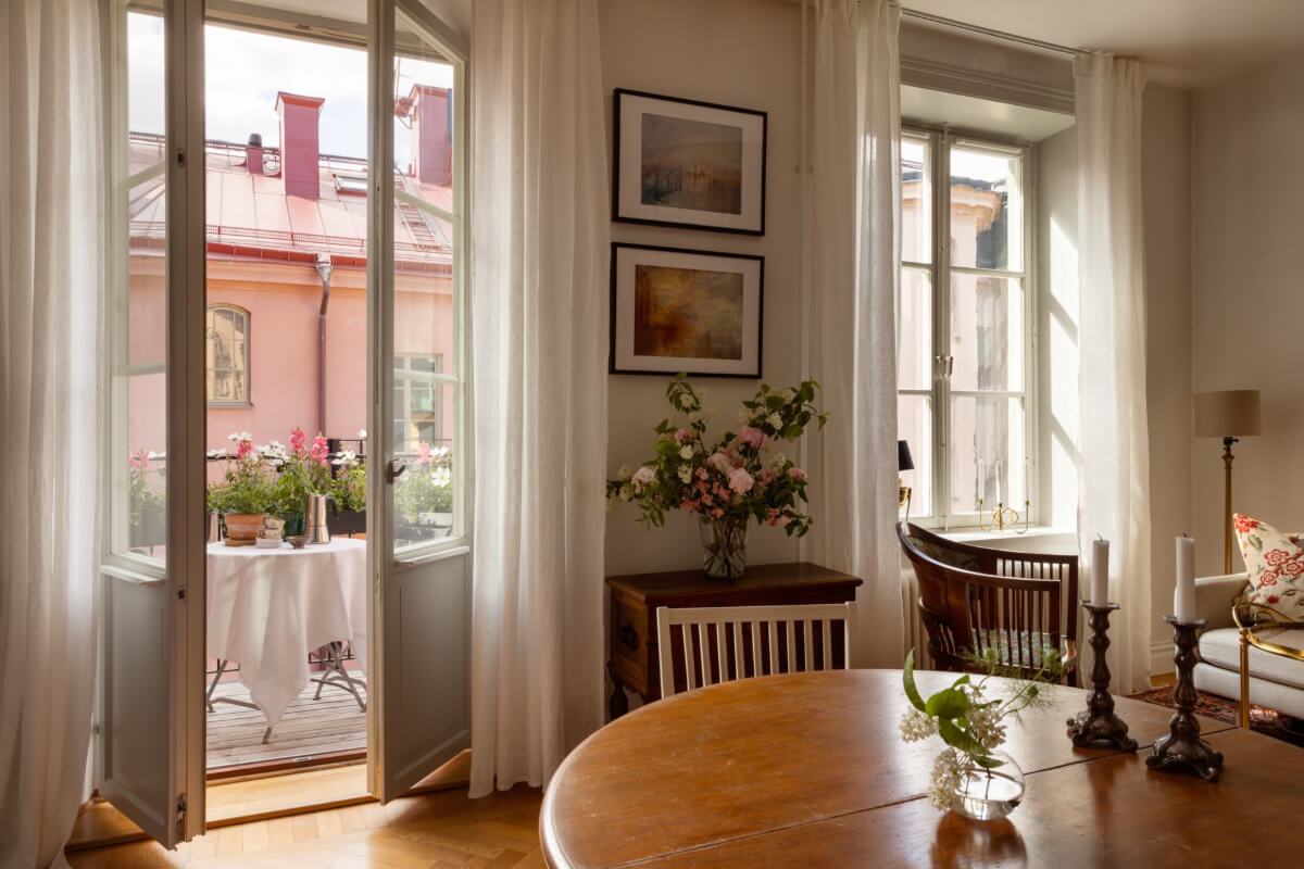 Antiques and Modern Additions in a Cozy Top Floor Duplex Apartment 6 large windows glass doors living room