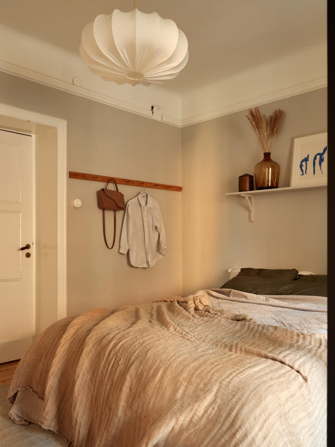 Historic Charm and an Industrial Glass Wall in a Stockholm Apartment 19 light gray bedroom shelf above bed