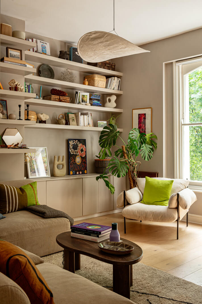 Muted Gray Tones and Built-In Storage in a London Apartment 2 living room farrow and ball paint color bookshelves