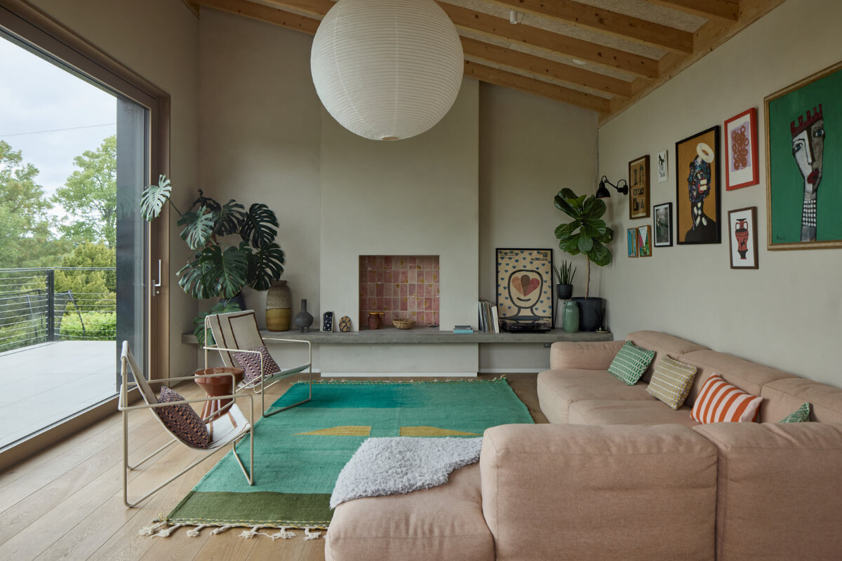 A Modern Bungalow with a Terrazzo Kitchen and Magnificent Views 2 living room fireplace pink tiles