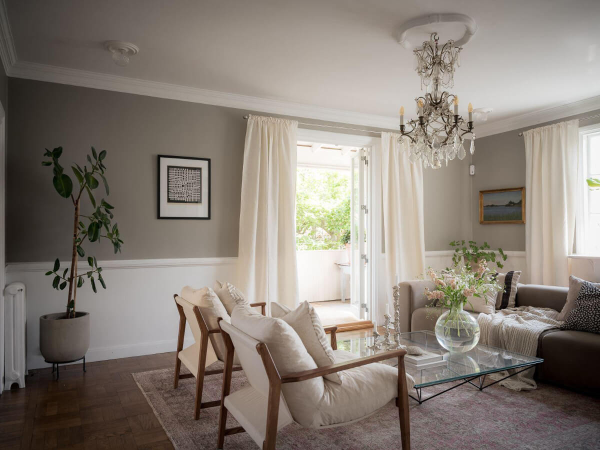A Floral Painted Ceiling in a 1920s Family Home in Sweden 3 living room gray walls high baseboards