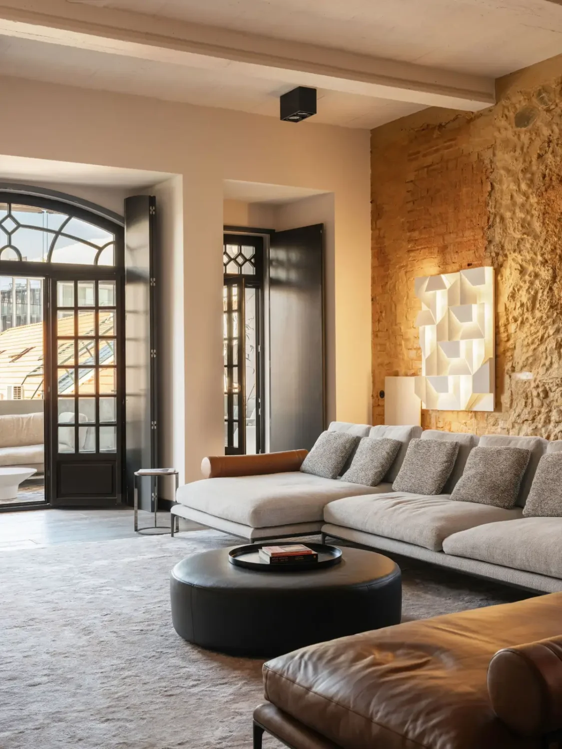 An Eye-Catching Stone Wall in a Beautiful Lisbon Apartment 2 living room lisbon apartment